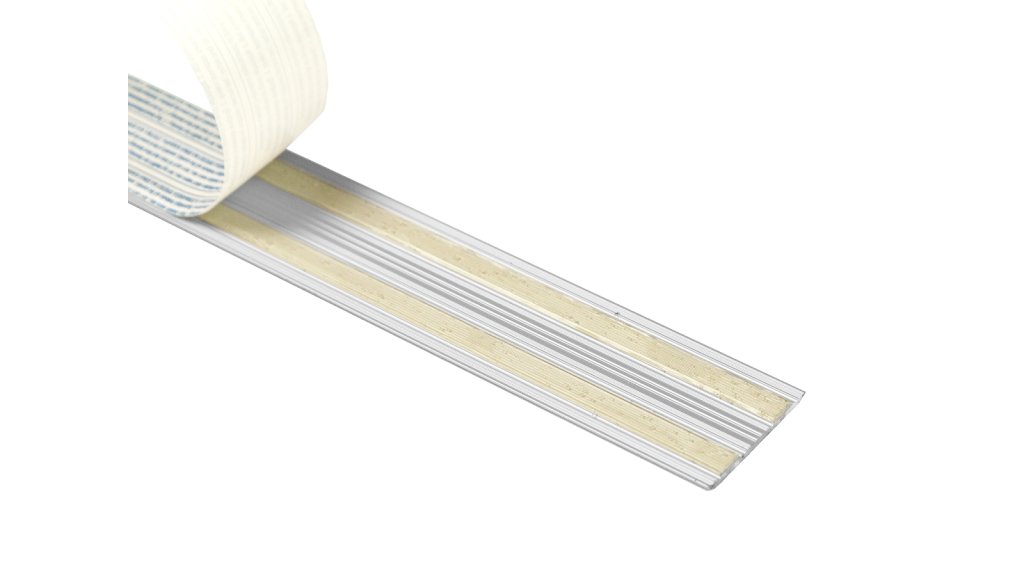 Kaučukové lepidlo na spodní straně samolepící přechodové lišty Küberit 442 SK